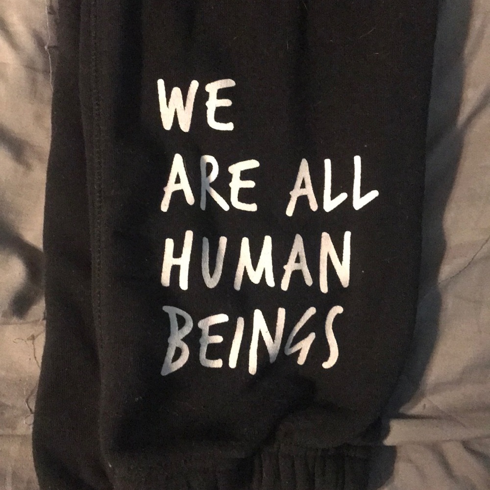 “We are all human beings” sweat pants